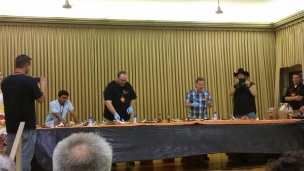 These crazy-ass mofos engaging in the Hellfire Steak Sandwich challenge. Notice they're wearing SURGICAL GLOVES for protection!