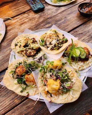 Starting from bottom and going counterclockwise: Daily Fish, Pork Belly Burnt Ends, Brussels Sprouts, Caramelized Cauliflower, Diver Scallop