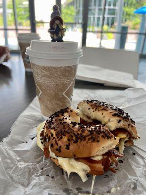 Onion bagel with cheese egg and bacon