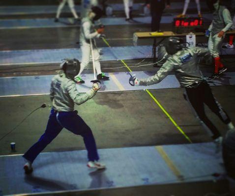 Fencer Giovanni C. fly's at Coach Hue during a warm up match at Temple University.