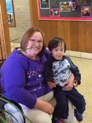 Jax and Mama Marsha waiting for award assembly to start for 4th grade