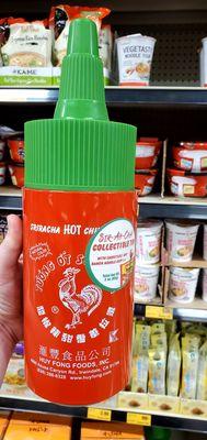 A GIANT Sriracha collectible tin, filled with special chopsticks and a packet of ramen. So cute!