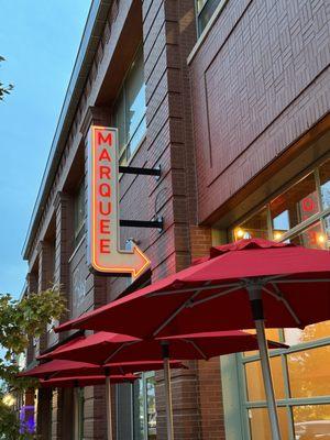 Exterior signage and umbrellas for the outside patio.