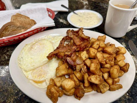 Breakfast Special with eggs, bacon, side of sausage gravy, potatoes, toast, coffee.   Breakfast Special Breakfast Special