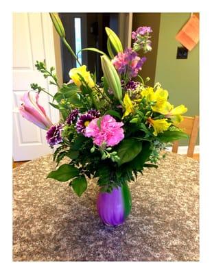 They did very well coordinating the vase with the flowers.