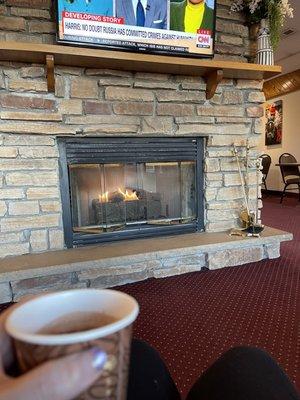 Fire place with a continental breakfast.