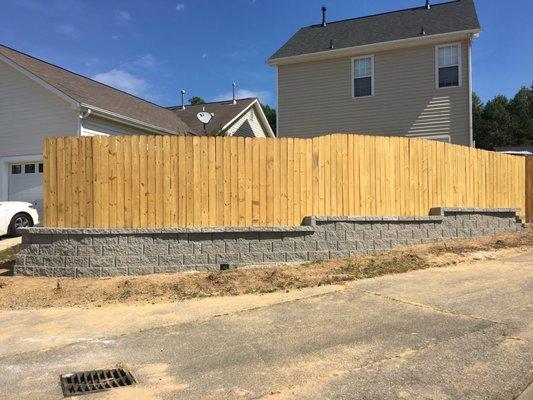 Grading with Supporting Retaining Wall and Privacy Fence Installation