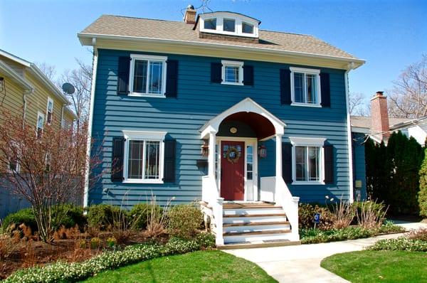 Glencoe House Remodeled by Siding & Windows Group, using James HardiePlank Siding in Evening Blue and HardieTrim in Arctic White