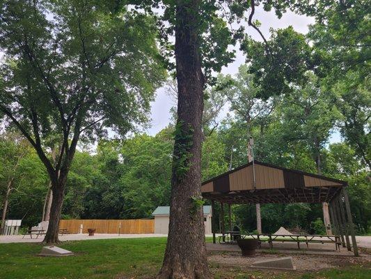 Pavilion with corn hole game in the shade