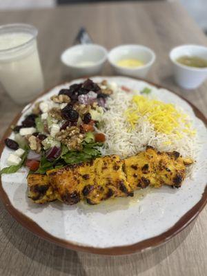 Chicken Kabob Skewer platter with rice and salad