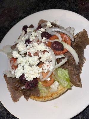 Zobra {feta cheese, Kalamata olives, lettuce, tomato and onion on grilled pita bread}