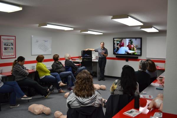 AH+RT Instructor Taneka teaching Adult/Infant CPR, AED & First Aid to the teachers of  Archbishop Howard.