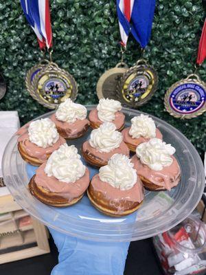 Strawberry cheesecake mini protein donuts with artisan nutritional whip cream