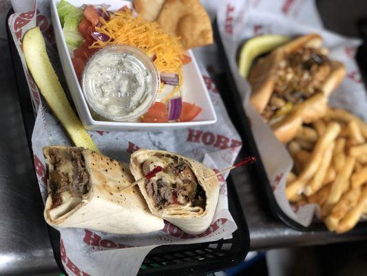 Philly cheesesteak in a wrap with a side salad yummy