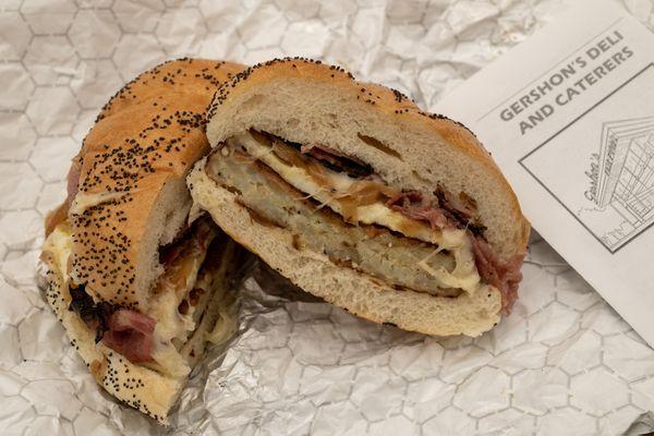 The Gershon - Hot pastrami, Swiss cheese, egg, sautéed onions and potato pancake on a hard roll.