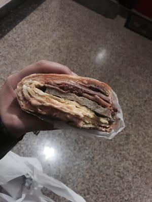 Delicious bacon, ham, sausage, egg, and cheese