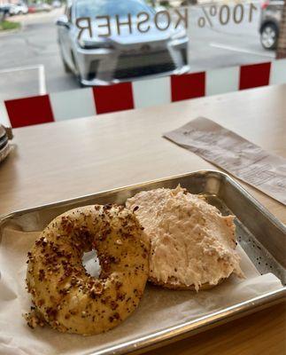 Salmon cream cheese on an everything bagel.