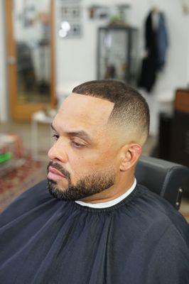 Medium fade and beard trim service with sharp line up