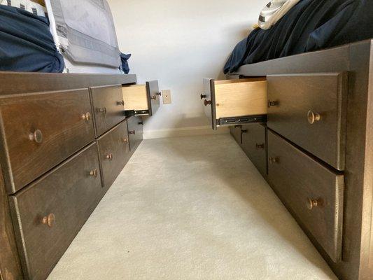 Twin beds with drawers.