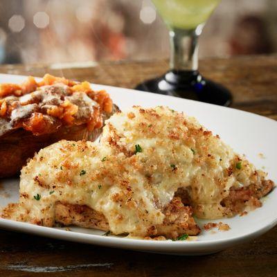 Order our Parmesan Crusted Chicken made with grilled chicken topped with a creamy Parmesan and garlic cheese crust.