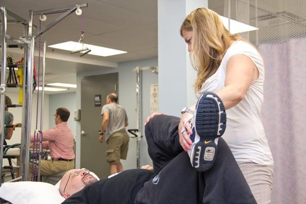 Physical Therapy staff working on patients at Orthopaedics Plus Beverly, MA office