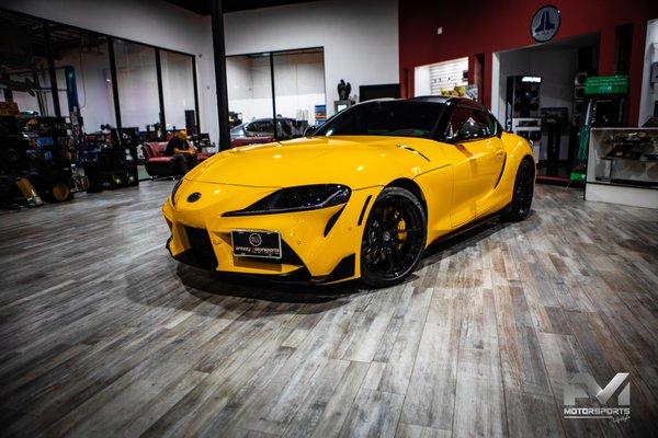 2020 Toyota Supra finished with:Blackout package, Caliper paint, Ceramic pro, custom vinyl design, smoke tail and head lights