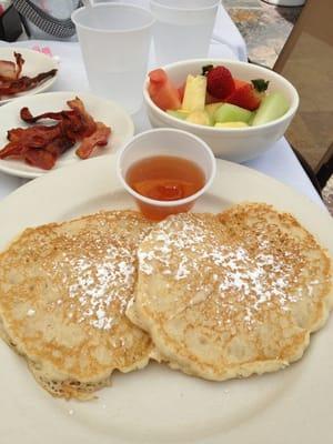 Pancake special w/side of bacon and big bowl of fruit.