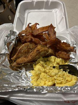 Soft scrambled eggs with bacon and French toast