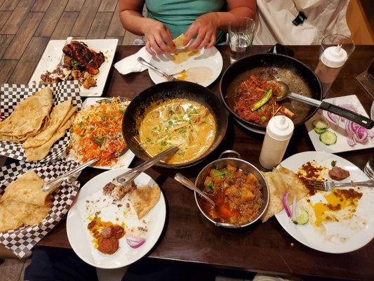 The feast! Loves their goat leg wok dish and creamy karahi chicken. Pass on the potato and okra.