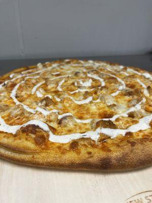 Tangy buffalo chicken pizza topped with house made ranch