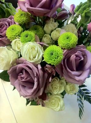 Lovely Lavender Bouquet - lavender roses, alstroemeria, white spray roses, bells of Ireland, green frosted vase. Photo by Vyvy.