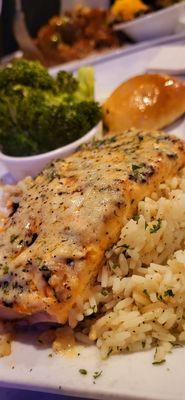 Salmon with white wine garlic butter sauce over rice and garlic butter streamed Broccoli.