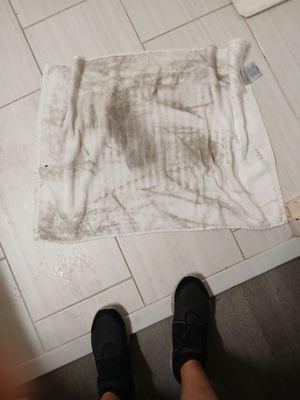 Towel used to wipe sticky floor when first arrived