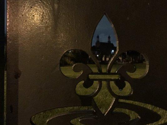 Looking through charity hospital front gate at st Patrick's cemetery