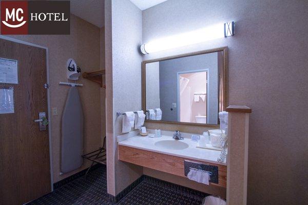 Vanity areas offer guests all the amenities of more costly hotels