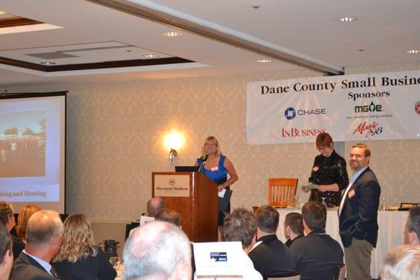 Leslie Johnson accepting the 2012 Dane County Small Business Award for Action