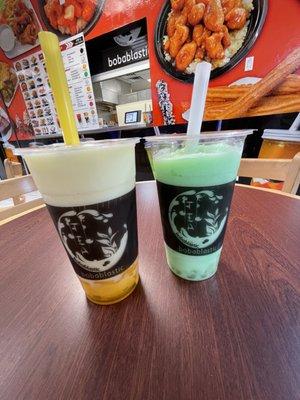 Honeydew smoothie with Boba and Creamsicle smoothie with rainbow jelly and custard