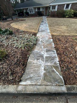 Soaping of granite walkway.