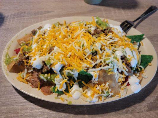 Carne asada nachos . Really good. They have full and half sizes. This is the half size