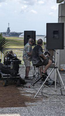 Steel drum and guitar playing and singing Jimmy Buffett