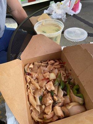 Chicken drunken noodles and green curry with chicken