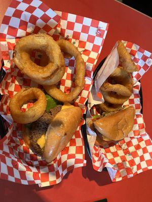 Cheeseburger and onion rings split.