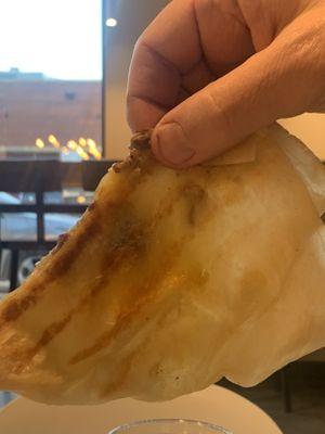 Held up to the light, you can see the contents. "Steak" quesadilla.