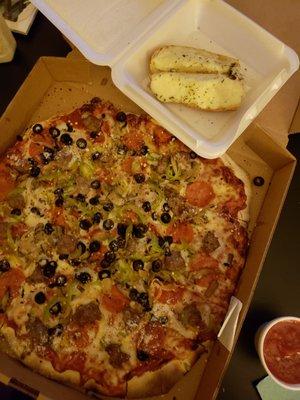 Drag's special with black olives and cheese garlic bread