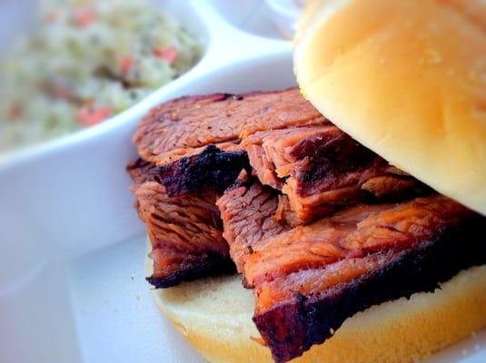 Beef Brisket Sandwich: Flavorful Brisket smoked for 16 hours.  Served w/ Cole Slaw, Chips & Horsey Bistro Sauce.