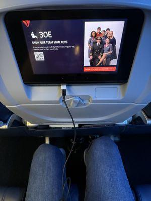 Leg room - of a middle seat 30E. I was offered headphones, and there is a usb to charge my phone with each seat