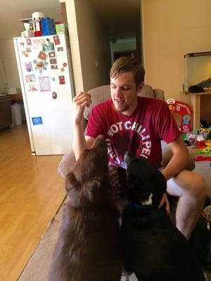 Jon and his two pups practicing basic manners in tandem.