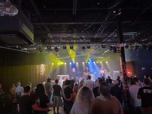 Artist Stage & Audience Listening Area: featuring The Hail Mary's. Standing and Seating room.