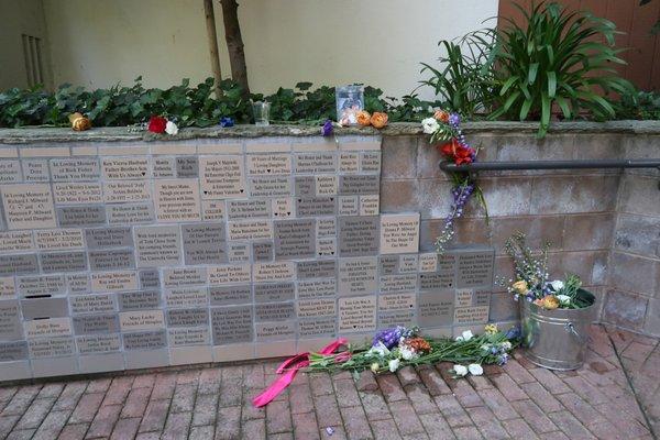 Flowers honoring loved ones at the Memorial Wall Ceremony. So much love in our community.