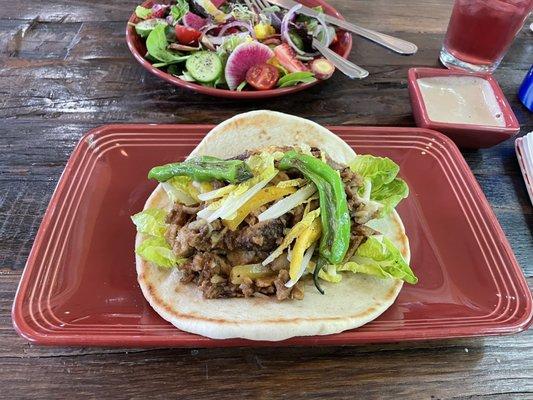 Caribbean Jerk Flatbread with vegan cheese and aoli.